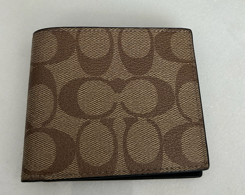 Cartera con estampado café - Coach