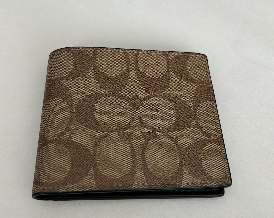 Cartera con estampado café - Coach